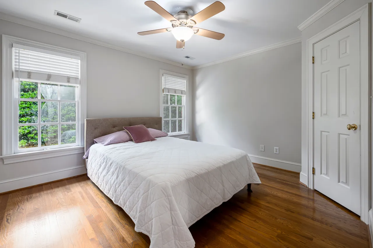A bright bedroom with fresh white bedding